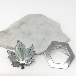 Pair of Silver Tone Metal Etched Maple Leaf and Hexagon Pin Brooches